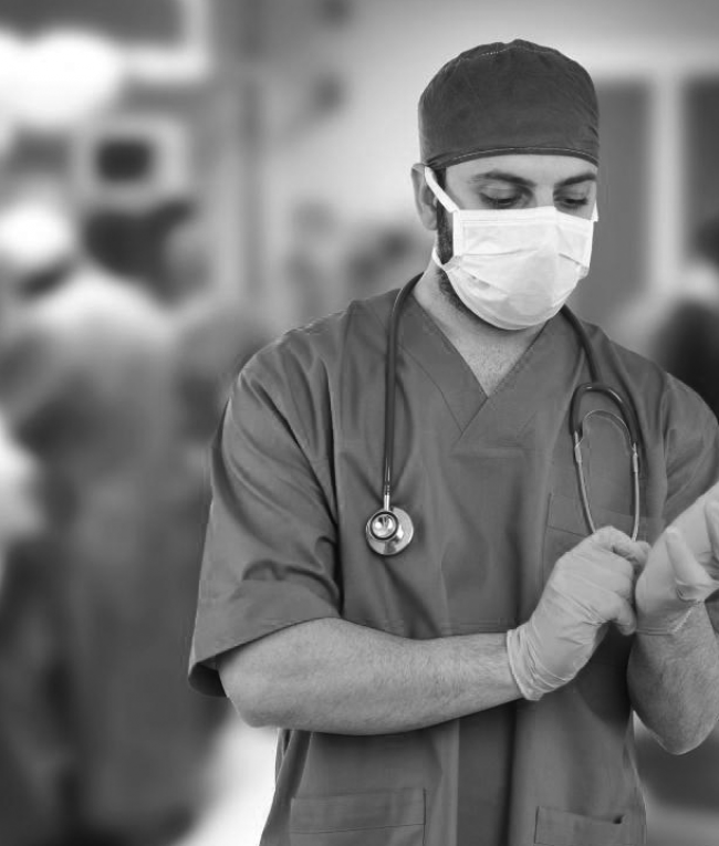 doctor-puts-on-surgical-glo doctor-puts-on-surgical-glo